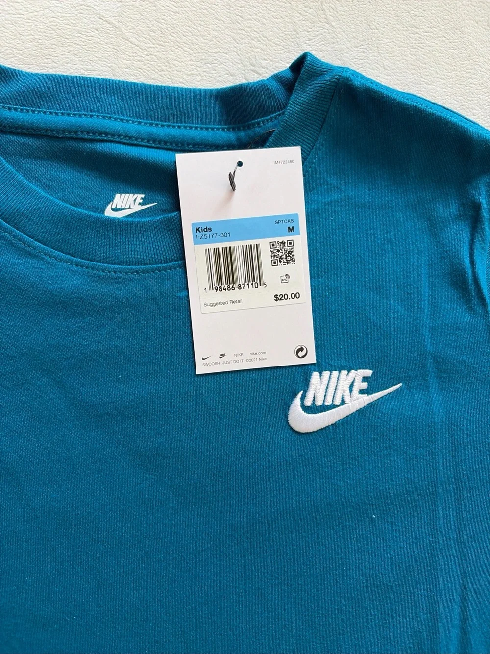 Nike Kids Teal T-Shirt with White Swoosh Logo